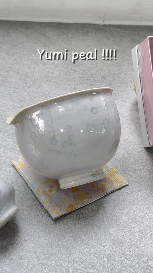 A white bowl on a coaster